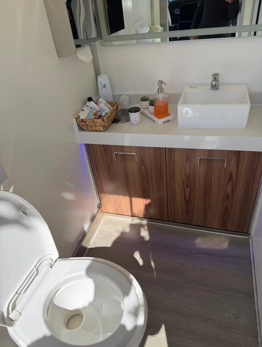 Wood vanity in a restroom trailer